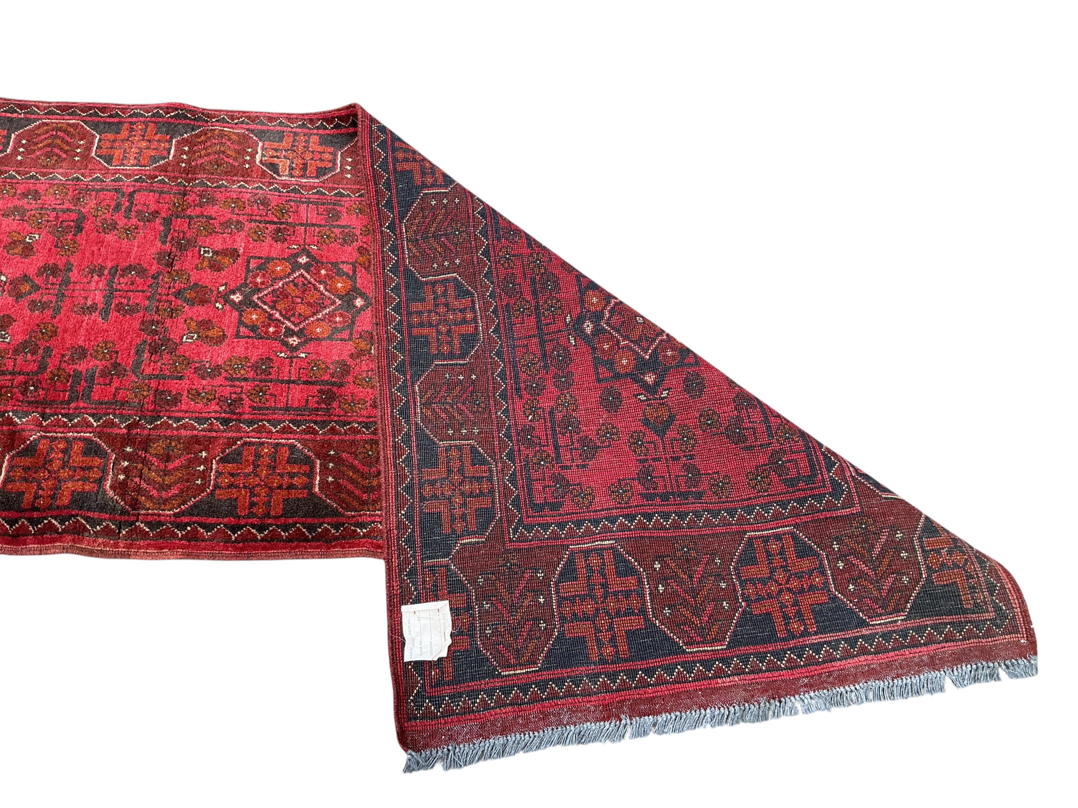 An Afghan runner, 285 x 80cm